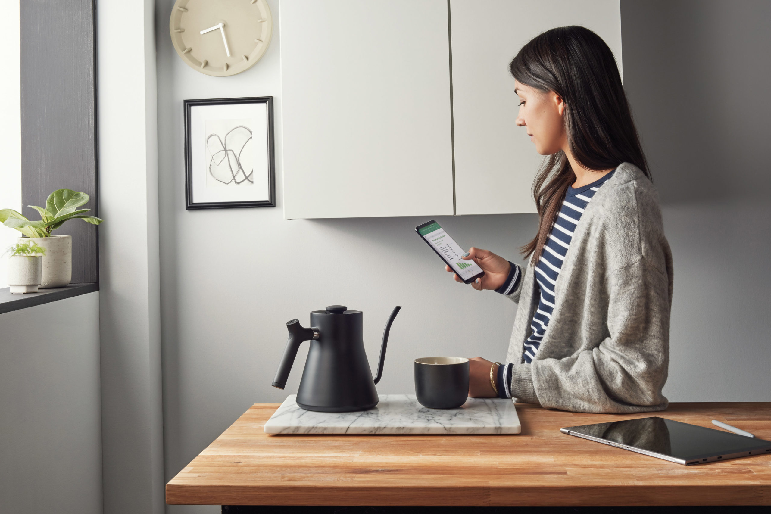 Woman looks at phone screen