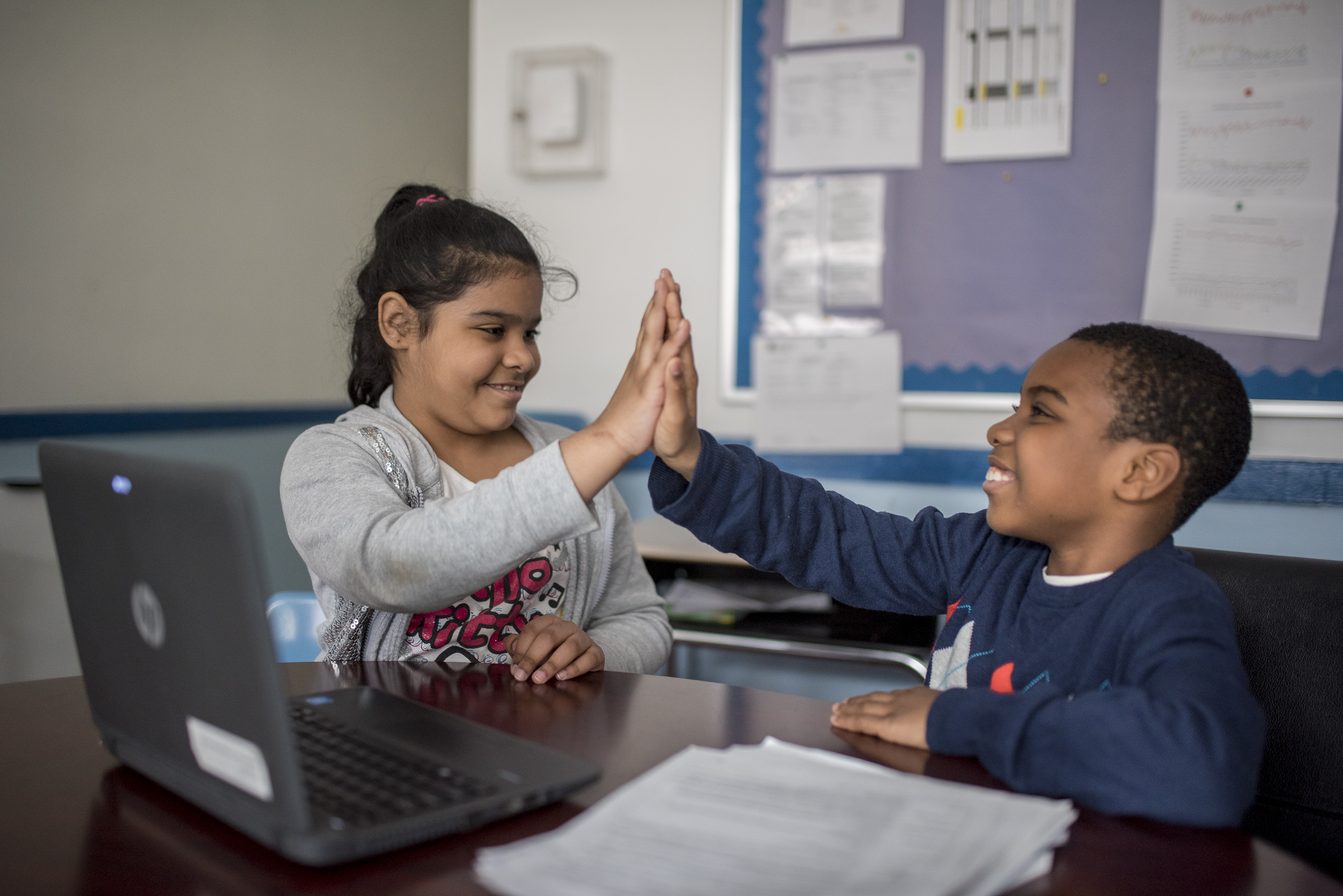 kids high fiving