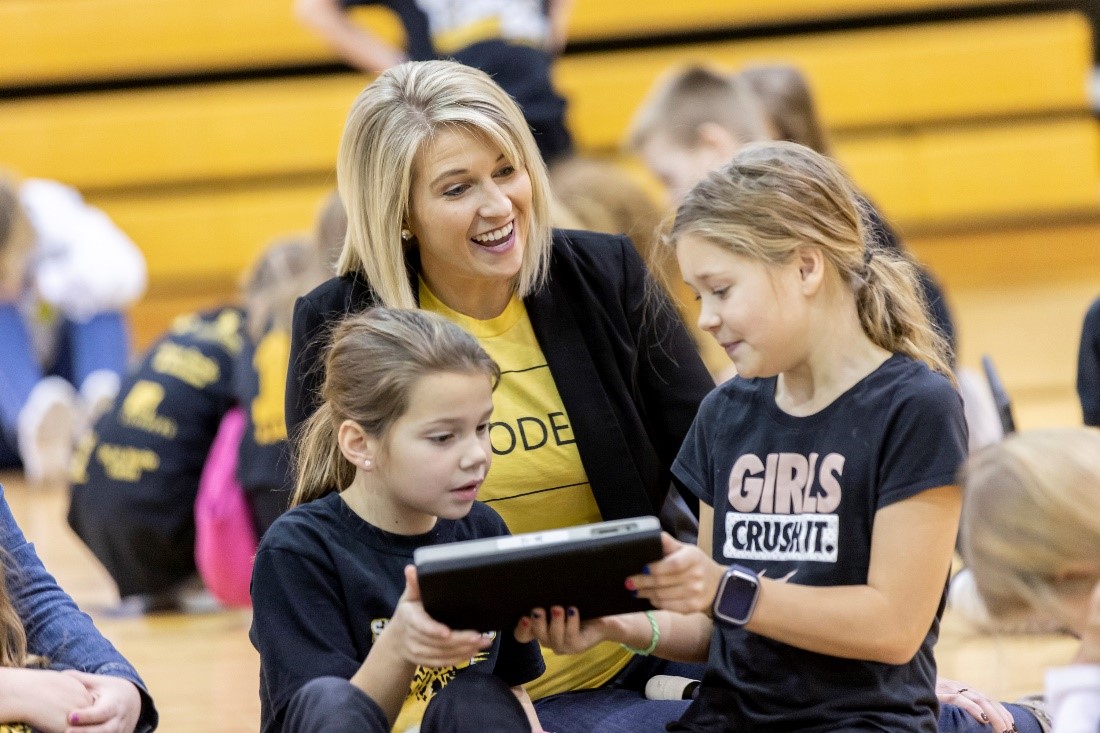 A woman and two girls at a TechSpark event