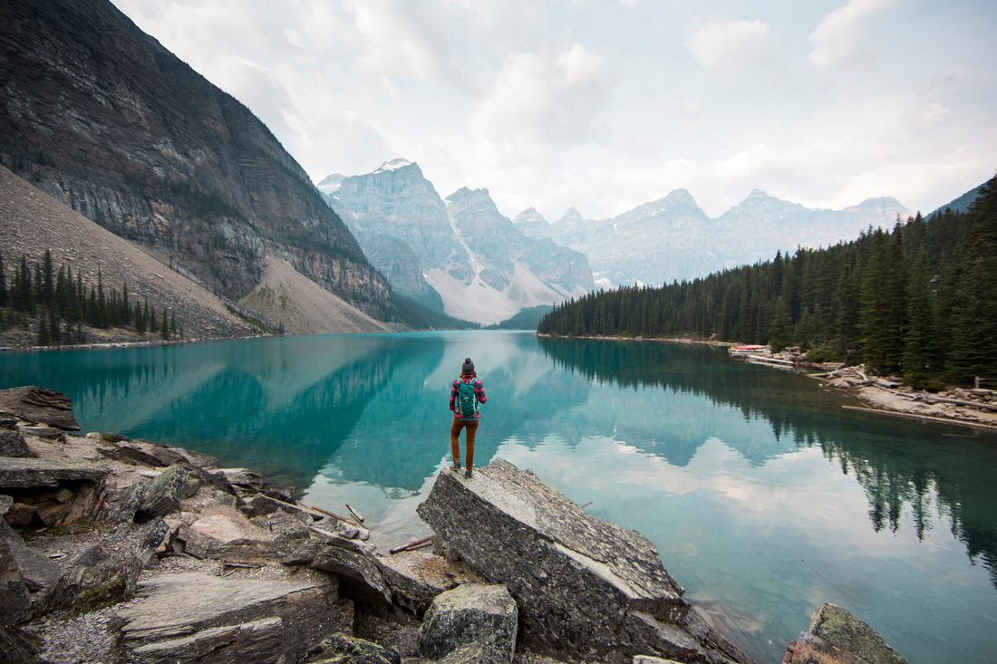Image of a a hiker looking out over a lake