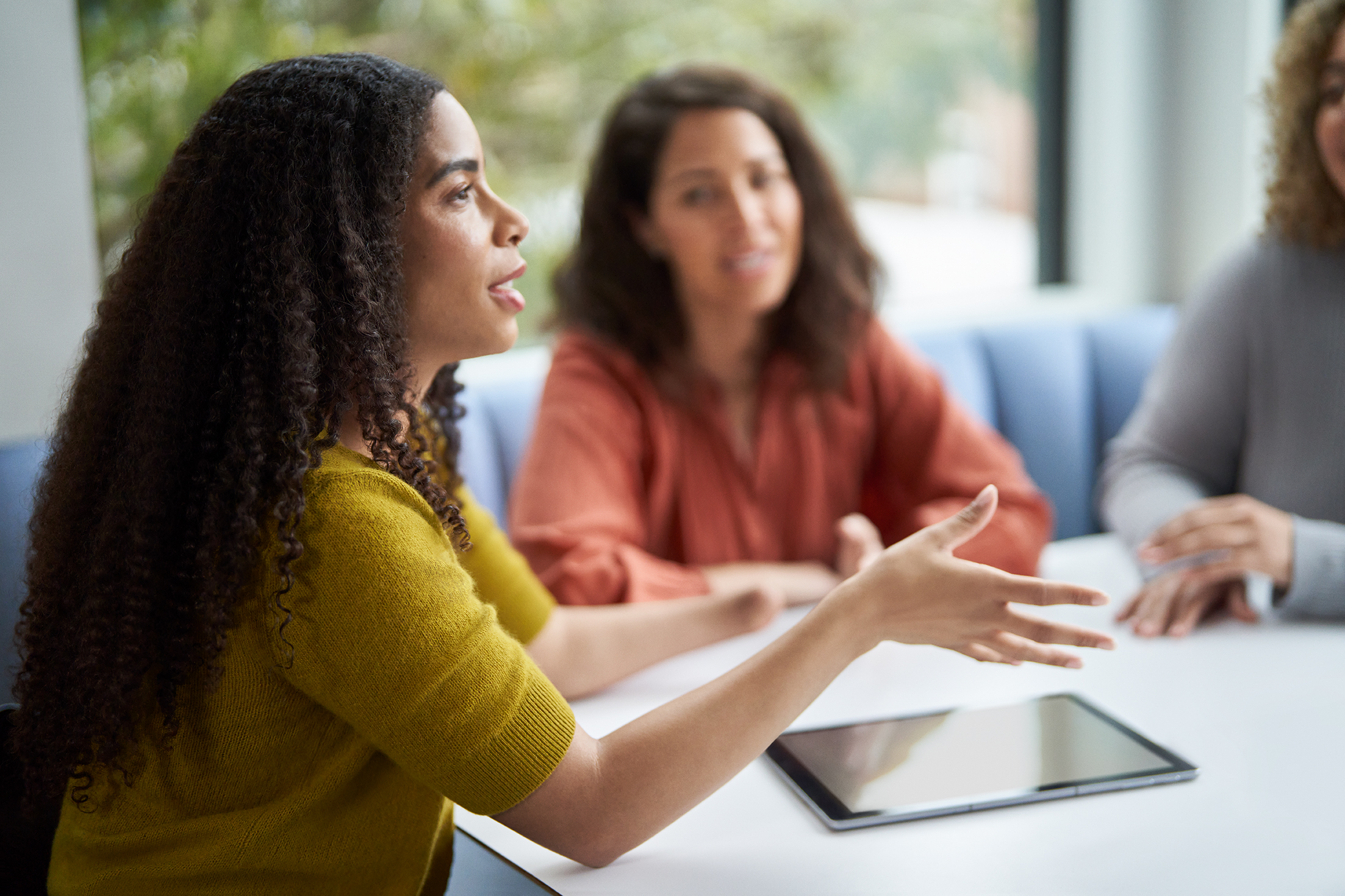 A group of people in a meeting